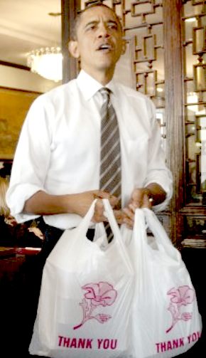 US President Barack Obama carrying plastic shopping bags
