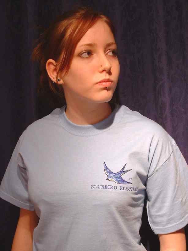 Cristina wearing one of the original T shirts with the blue bird logo