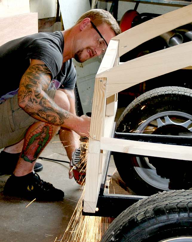 Terry (project co-founder) cutting a chassis rail to length