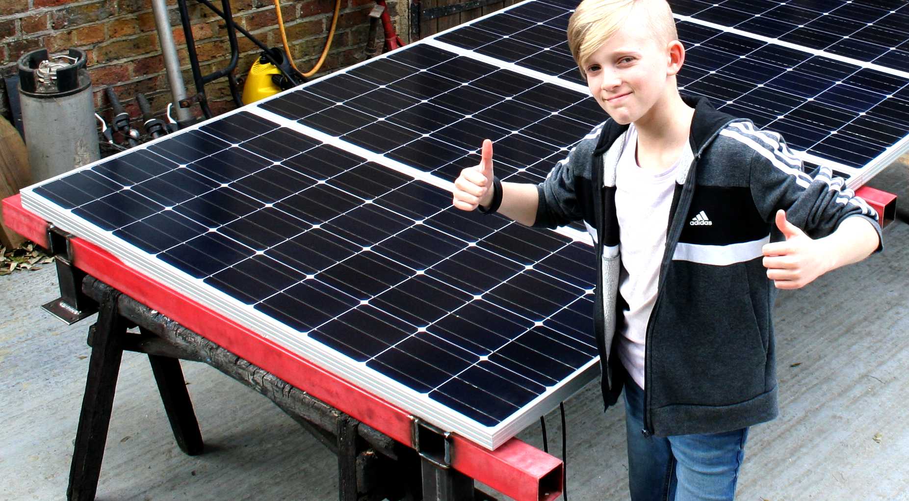 Ryan checks out a solar panel array