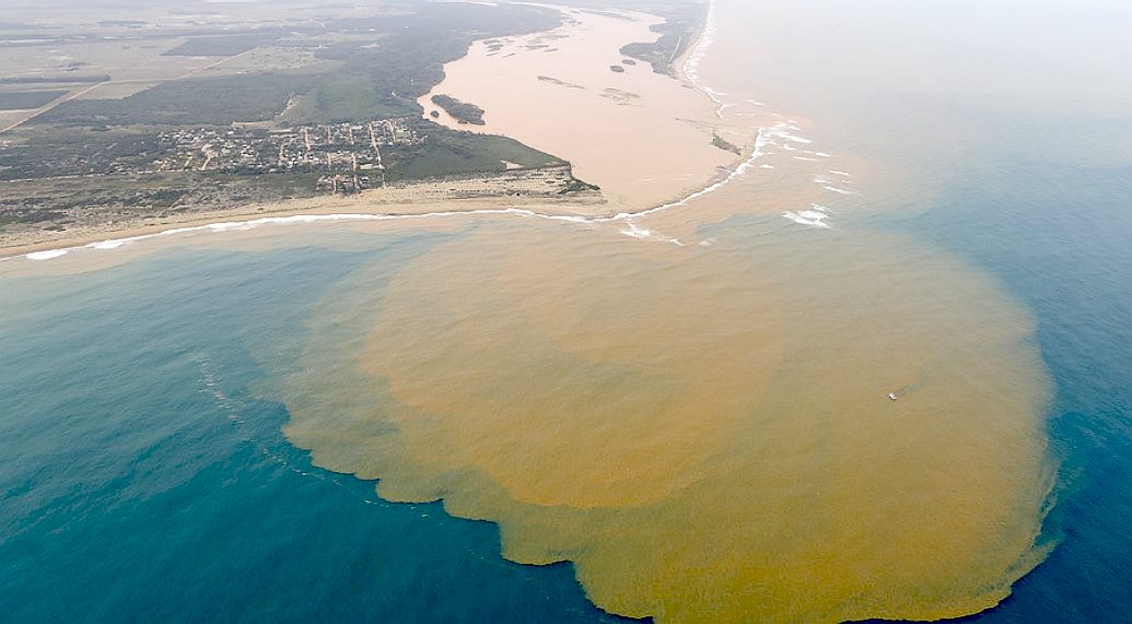 Rio Doce exits into the Atlantic Ocean with a vast mud plume