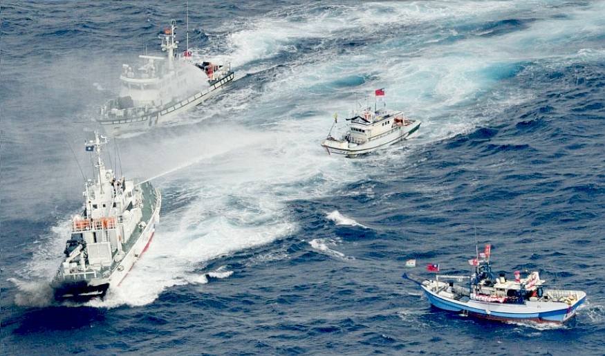 Water fight at sea with fishing boats getting wet